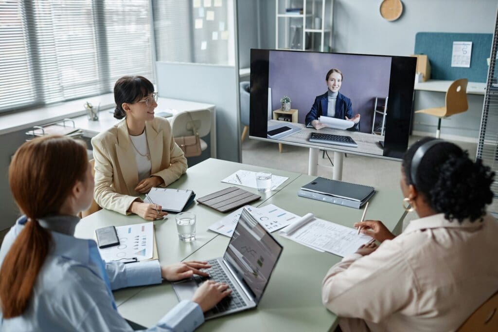 Female Coworkers Discussing Business during Video Conference